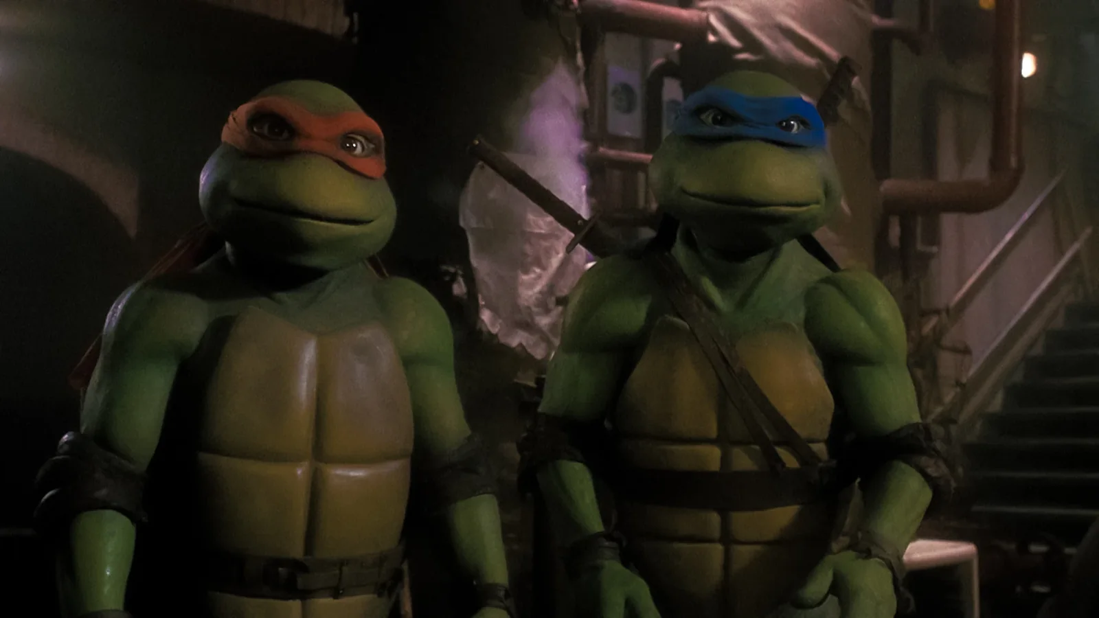 Michelangelo and Leonardo in the sewer lair.