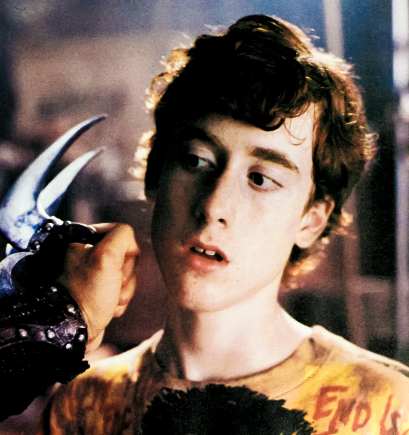 Casey Jones faces off with a sai at his cheek.
