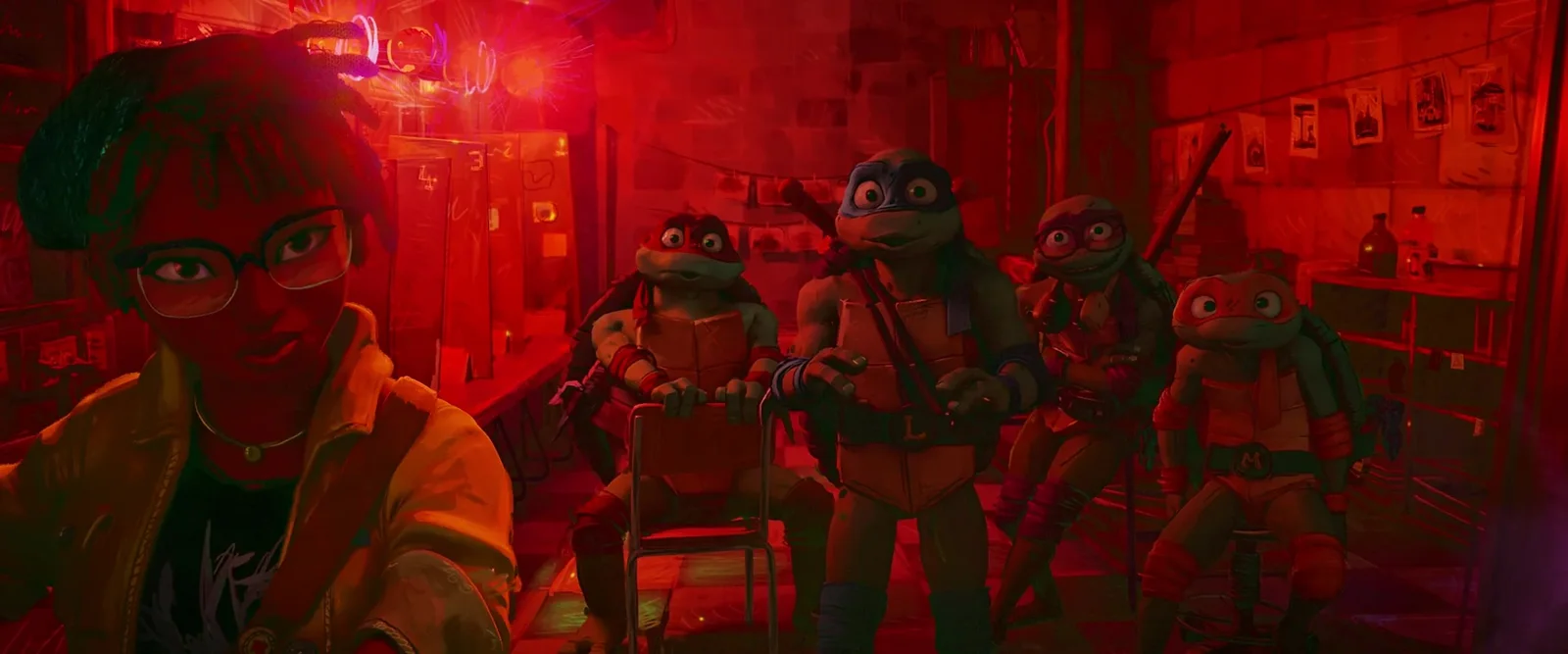 April and a turtle share a quiet beat in the red glow.