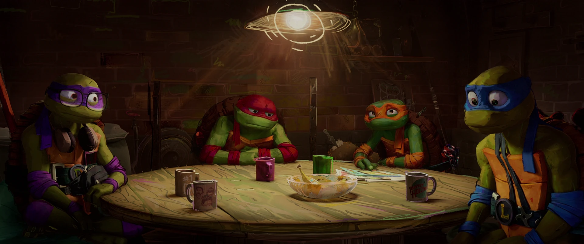 The four Turtles sit around a cluttered wooden table under a single overhead light in the sewer lair.