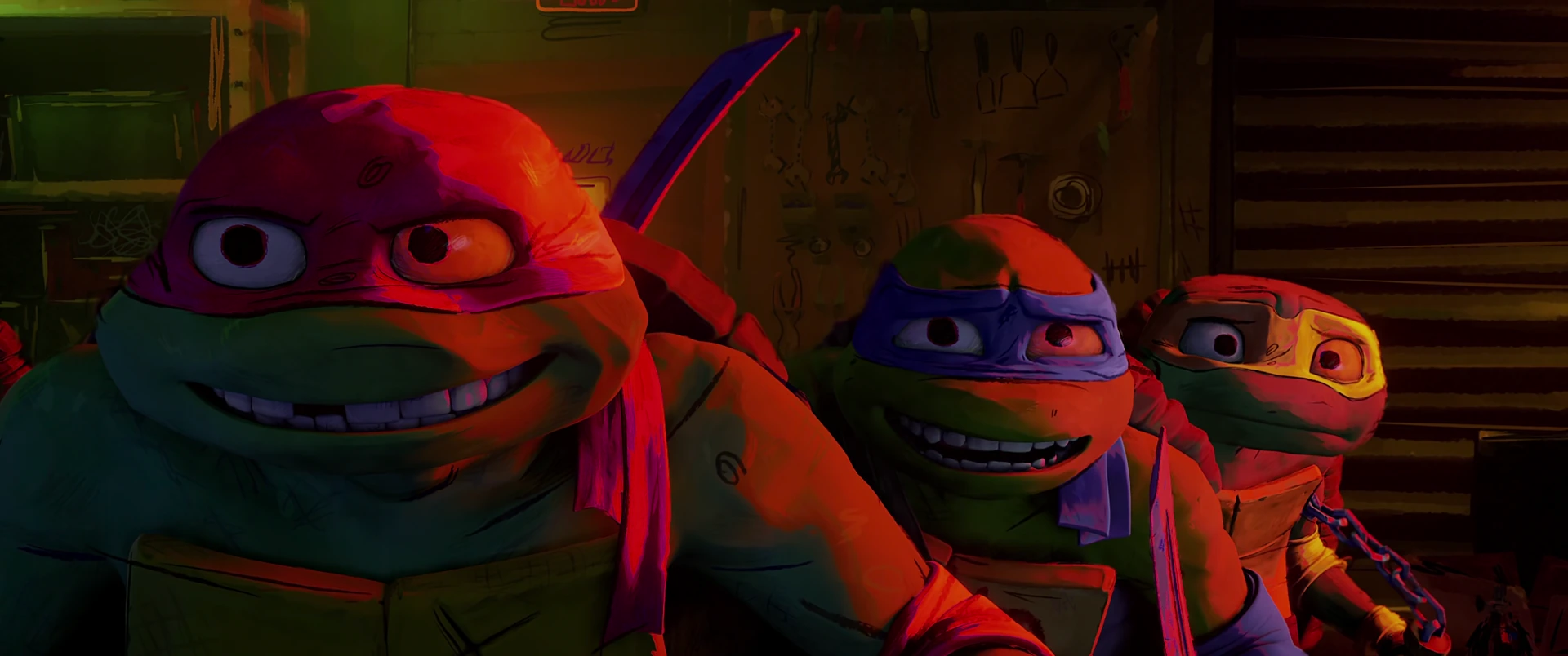 Three Turtles grin nervously side by side in red-tinged garage light, expressions mixing excitement and fear.