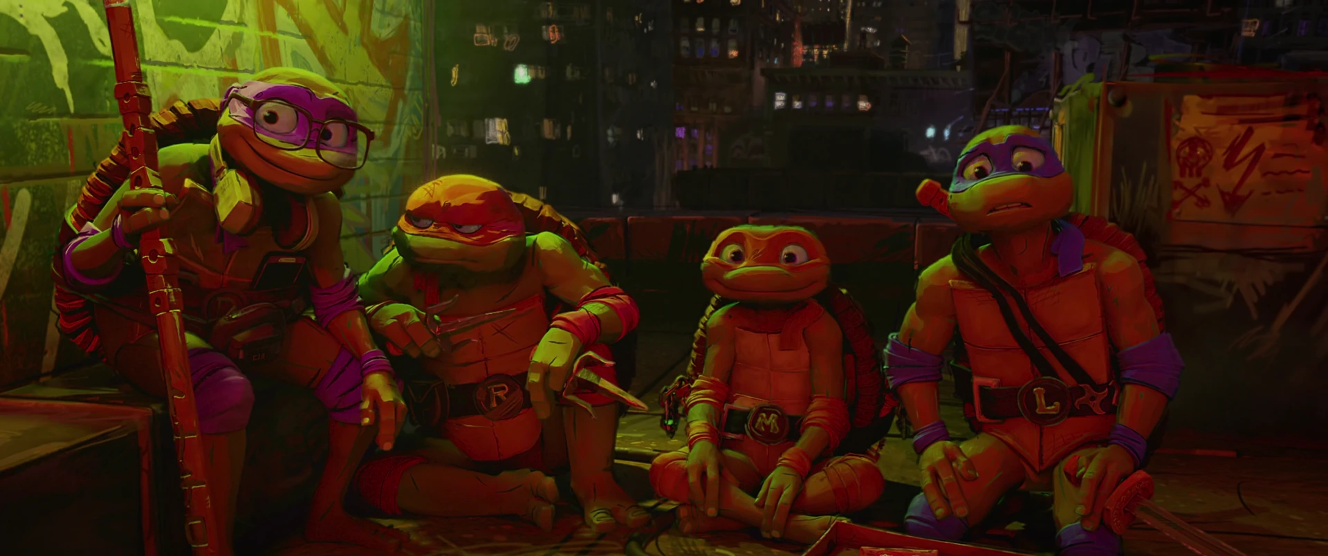 All four Turtles sit in a row against a wall in warm red and purple light.