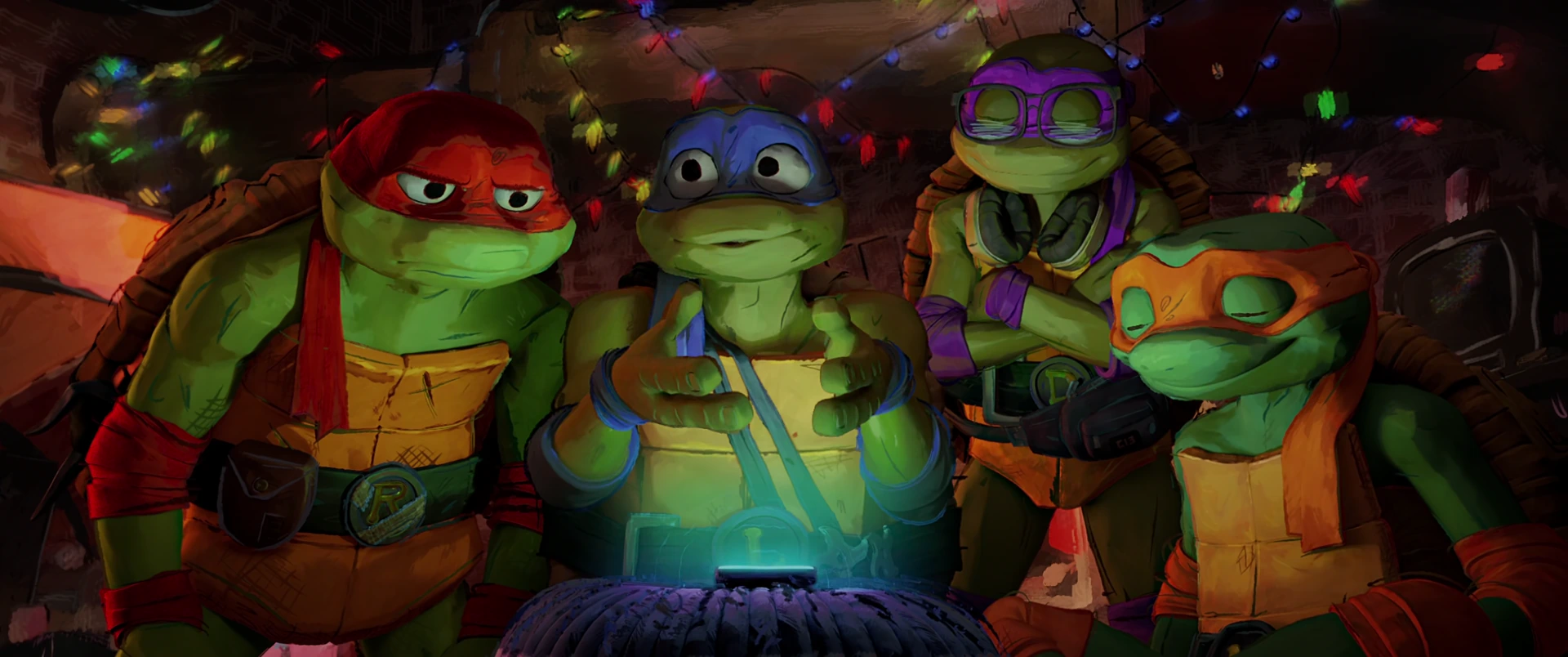 All four Turtles lean over a glowing device in their decorated sewer lair, faces lit with warm anticipation.
