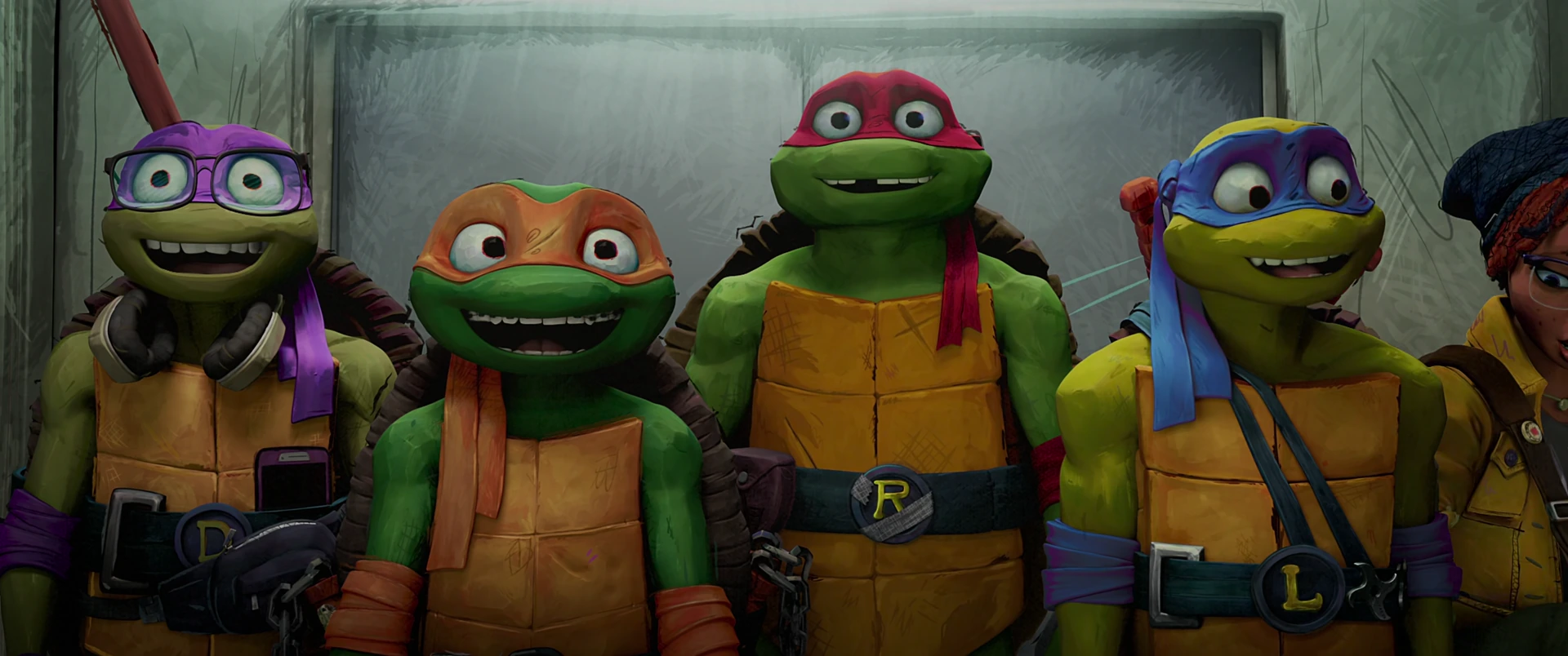 The four Turtles stand shoulder to shoulder at a locker bank, staring ahead with wide excited eyes beside April.