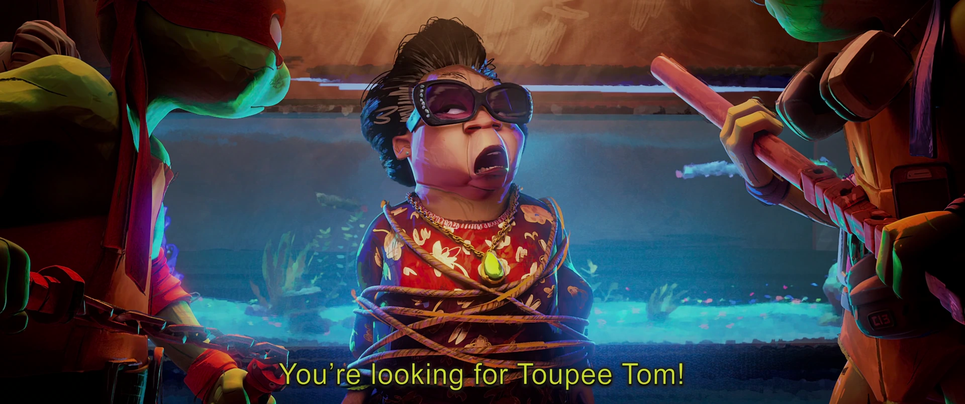 Bebop sits tied up and wide-eyed between Leo and Raph who press close as Mikey looms over his shoulder.