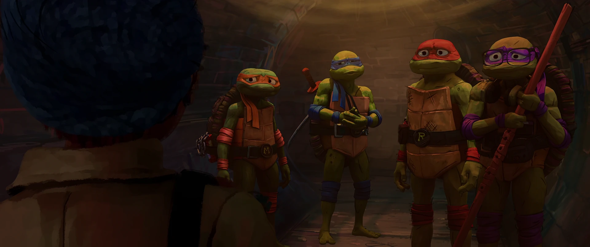 The four Turtles face someone off-camera in a warmly lit alley, Leo holding swords and Raph crossing his arms.