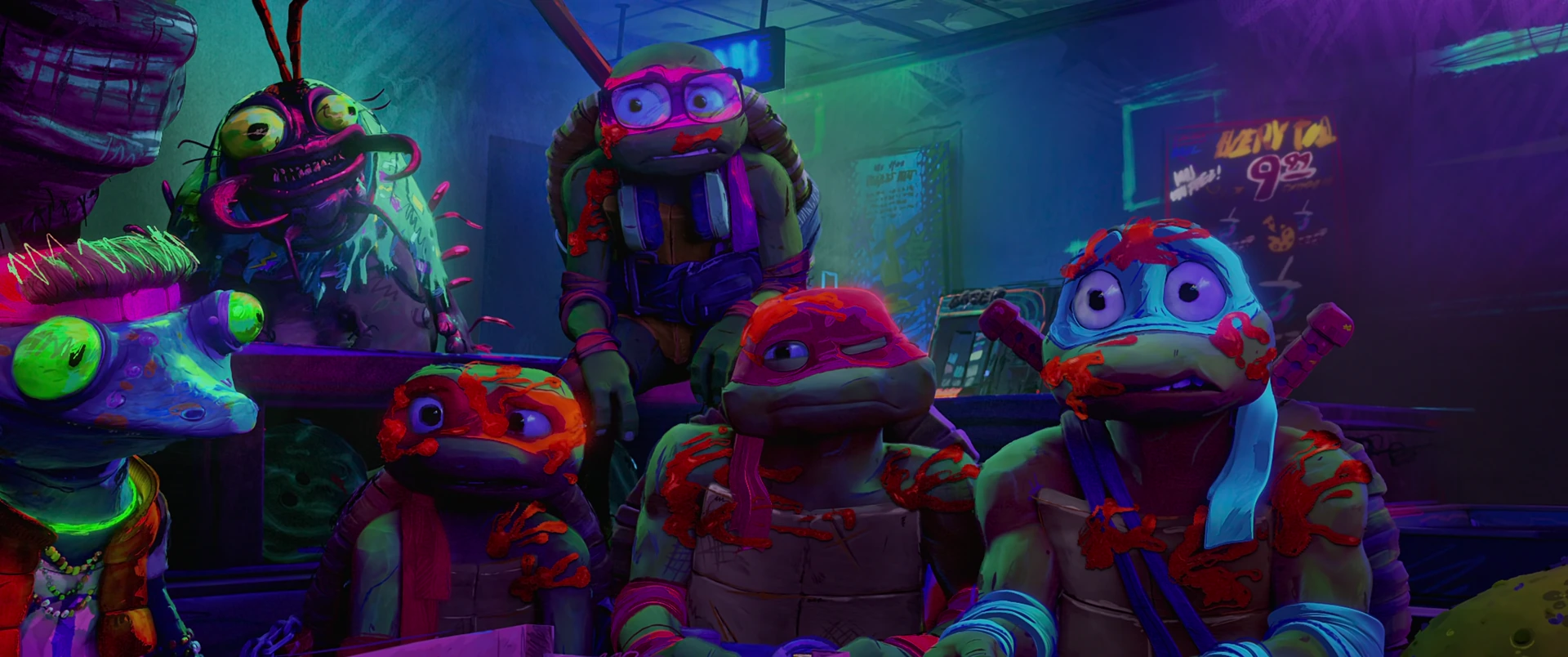The four Turtles and Genghis Frog react with stunned discomfort under harsh neon light inside the gang’s crowded hideout.
