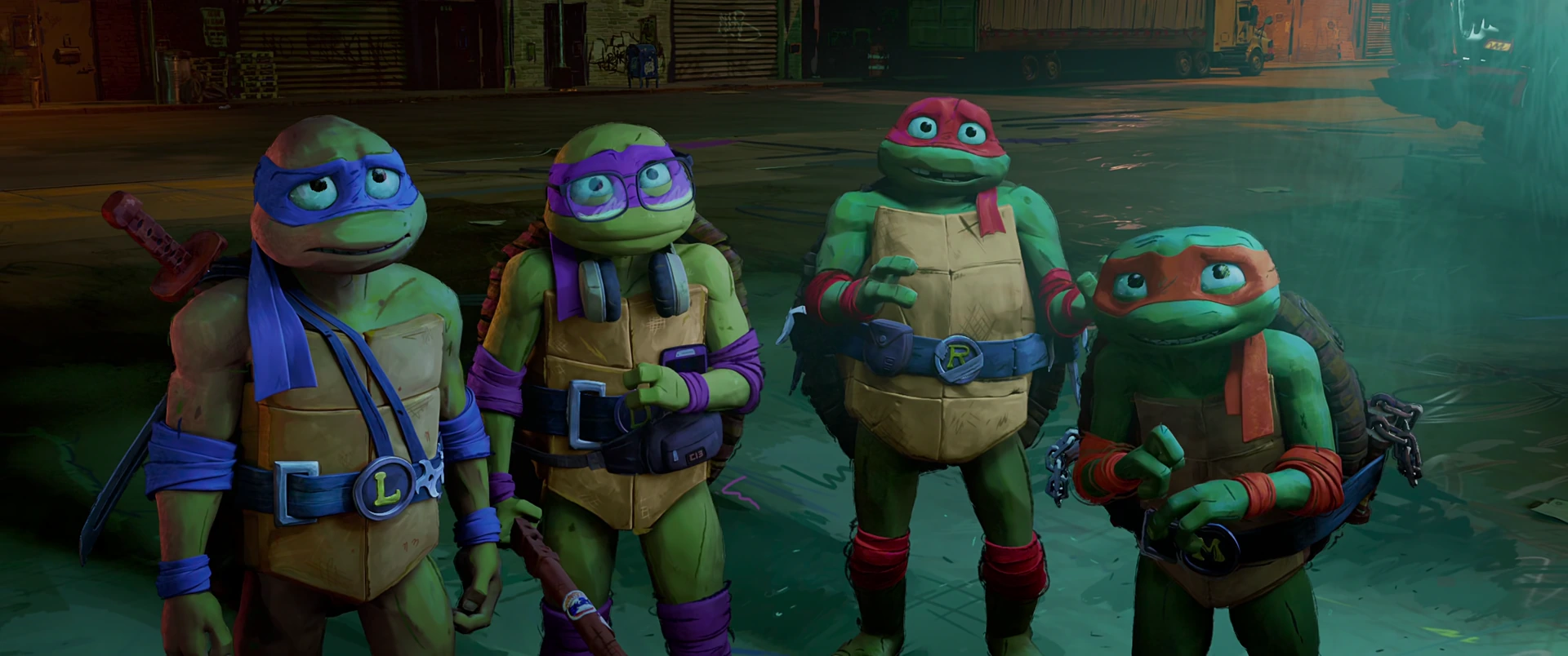 All four Turtles stand in a row on a dark NYC street, weapons ready, looking serious and unified.