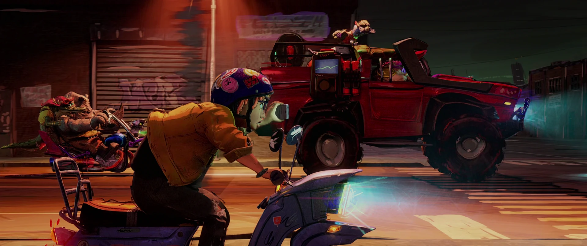 April charges forward on her scooter toward Bebop and thugs as a red monster truck bears down behind them.