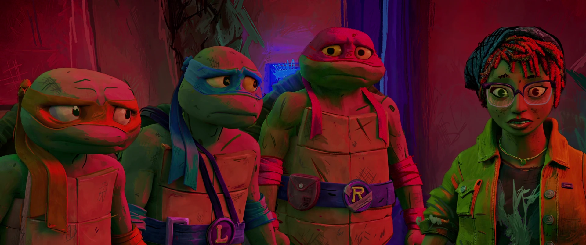 Three Turtles and April huddle close in tight close-up with grave expressions under deep crimson light.