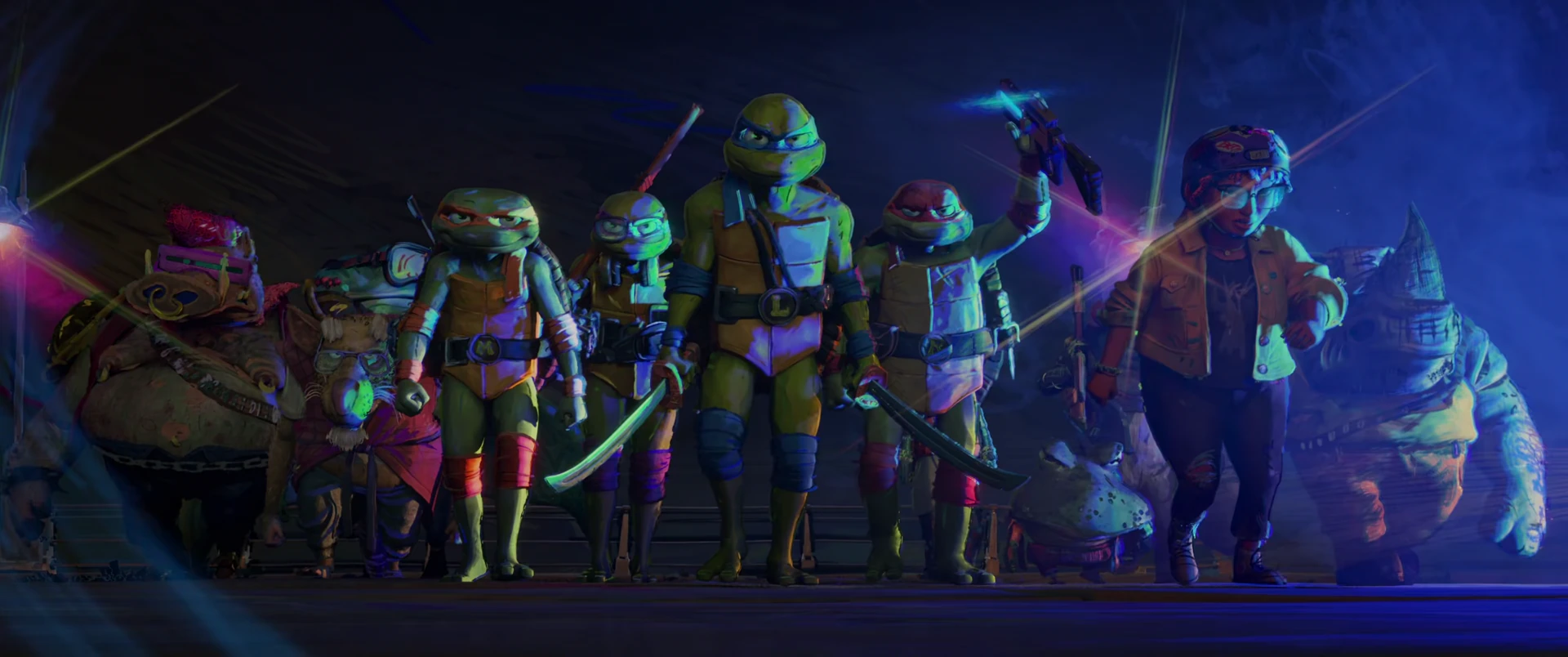 All four Turtles and their mutant allies line up in a heroic formation on a ruined street, weapons raised for the kaiju battle.