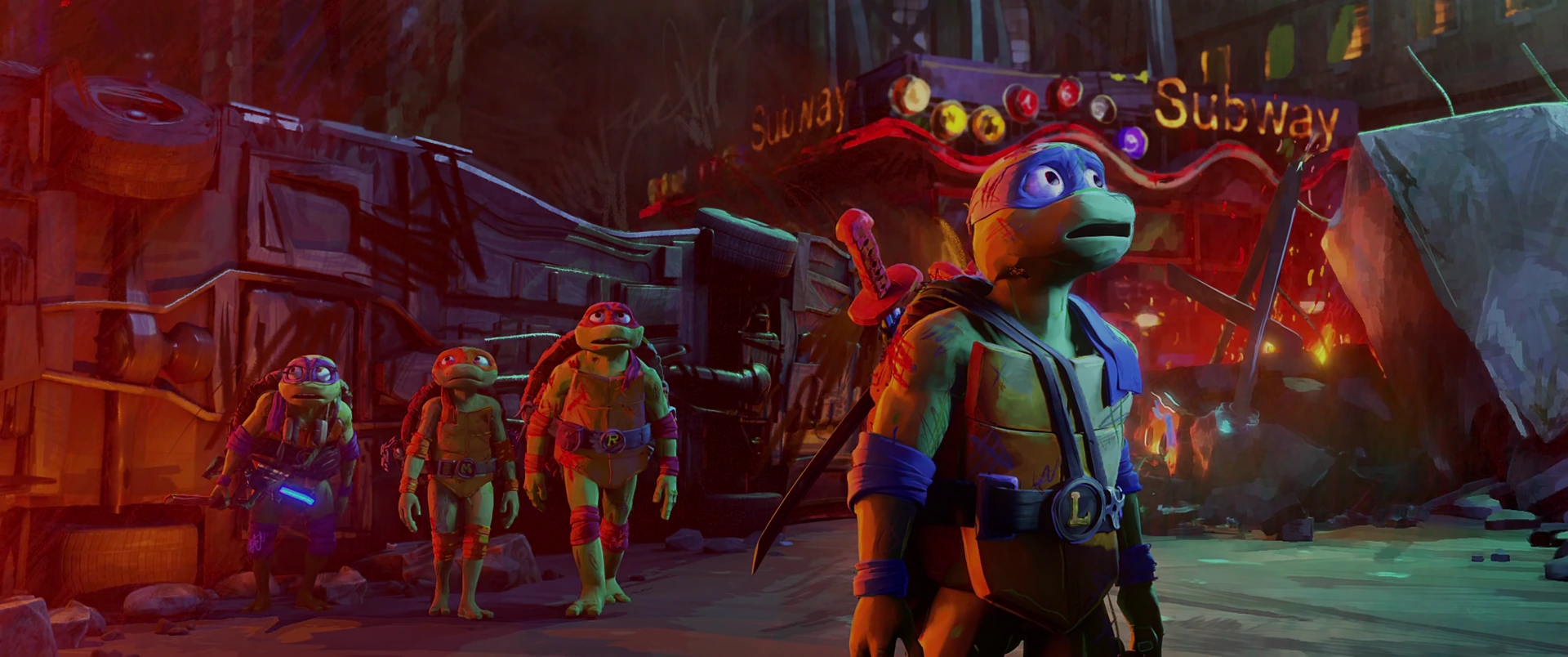 All four Turtles stride in hero formation through red-lit destruction toward camera past a wrecked Subway entrance.