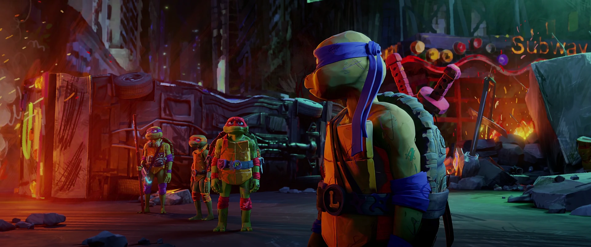 Leonardo faces away from camera near the Subway wreckage as his three brothers approach behind him.