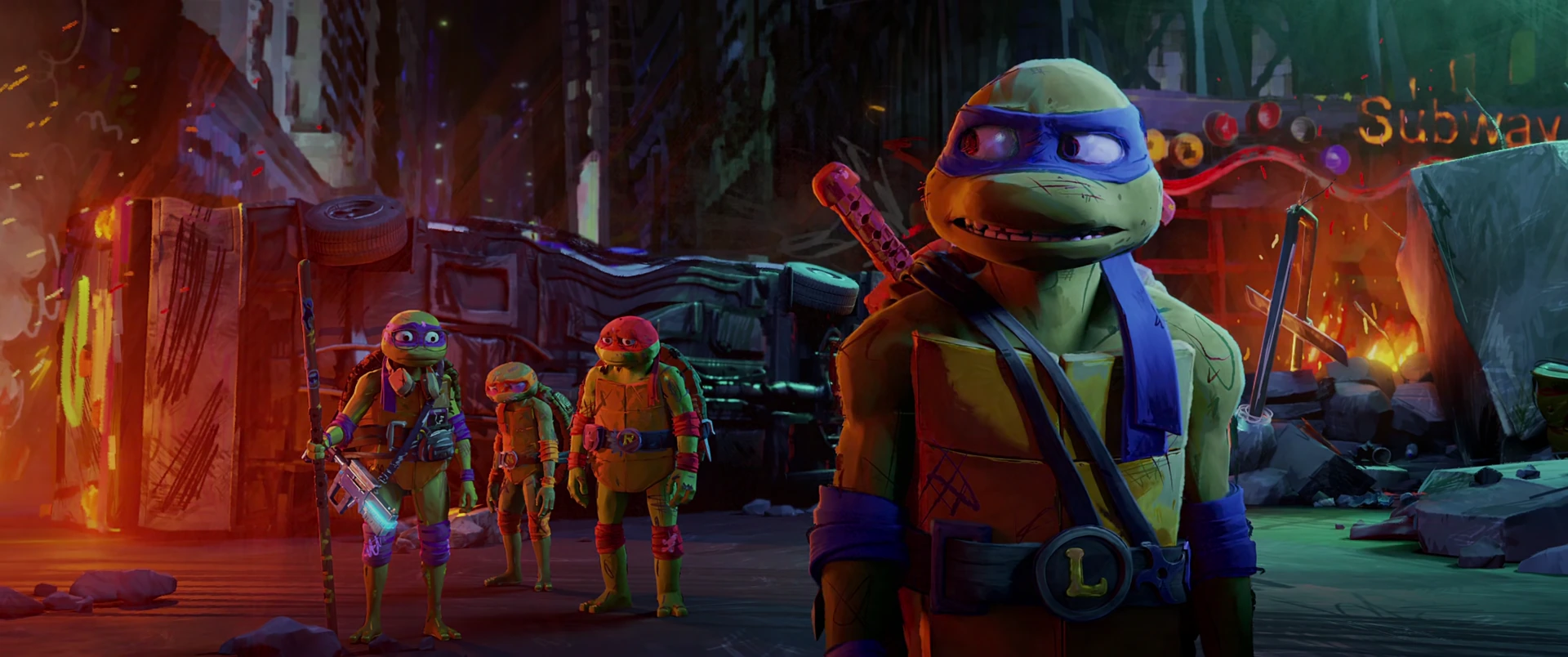 Leo faces forward in the foreground with his brothers behind him as he steps up to take charge in the burning street.