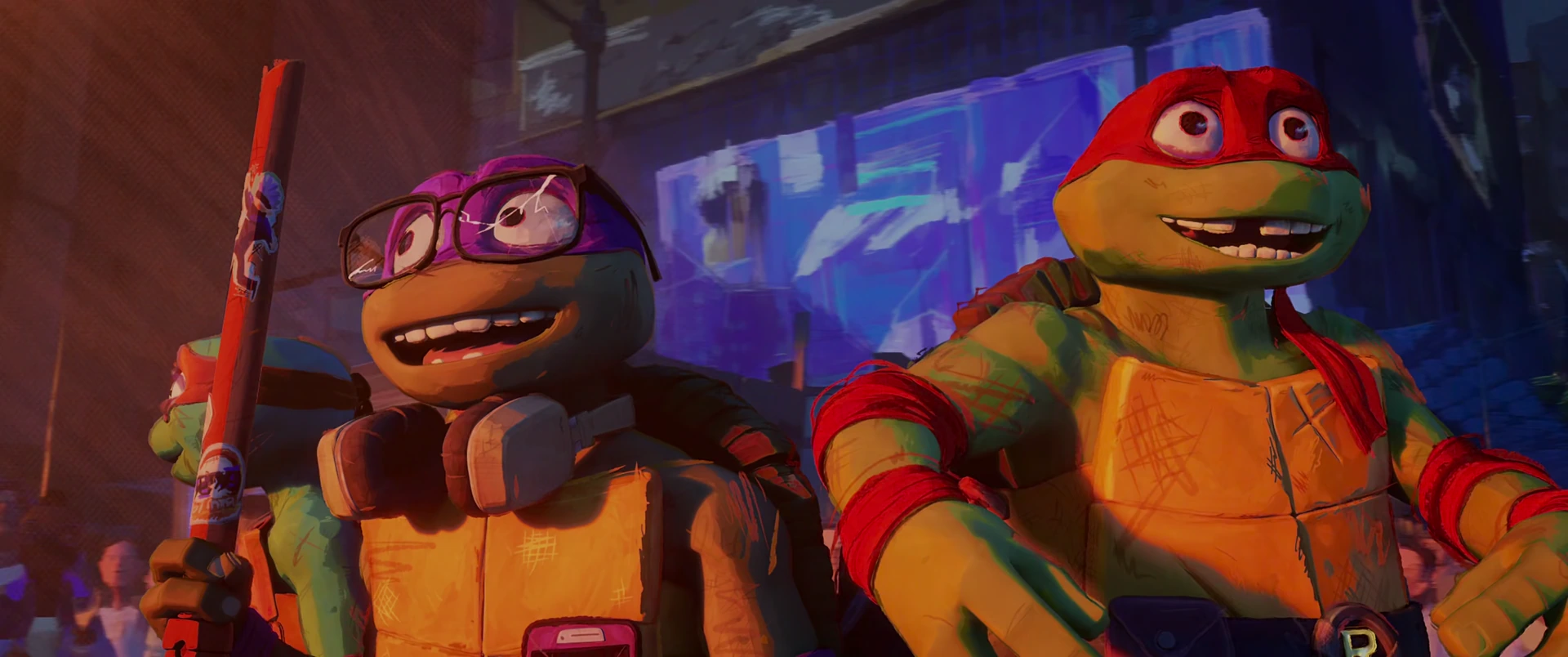 Donatello and Raphael grin side by side with triumphant joy as the crowd cheers them as heroes in Times Square.
