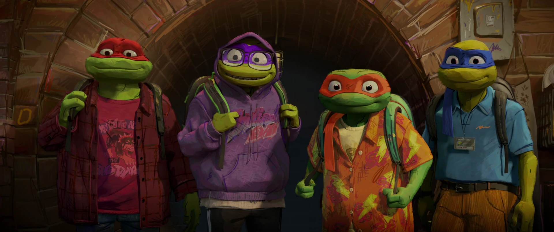 All four Turtles stand shoulder to shoulder in a brick archway in casual clothes and backpacks, ready for their first day of school.